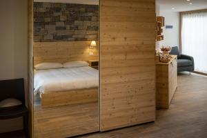 A bed or beds in a room at Casa Galèt
