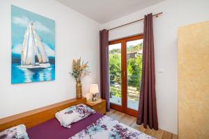 Ένα ή περισσότερα κρεβάτια σε δωμάτιο στο Apartments Maris