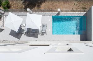 a swimming pool on the roof of a house at Villa Ona in Port de Soller