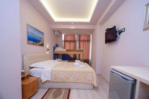 Postel nebo postele na pokoji v ubytování San Marino Hotel