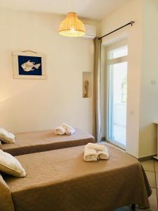 Ліжко або ліжка в номері Beach House Ilaria - Turchese Apt