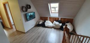 an attic room with a bunch of bags on the floor at White House Pärnu in Pärnu