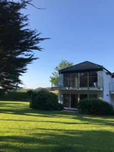 a large house with a large lawn in front of it at Coedrath Park 14 - Short Walk to Beach, Ground Floor, Parking in Saundersfoot