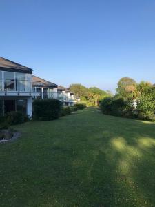 a large yard with a house and a building at Coedrath Park 14 - Short Walk to Beach, Ground Floor, Parking in Saundersfoot