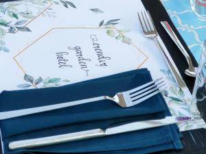 a fork and knife sitting on top of a table at Erendiz Garden Hotel in Kemer