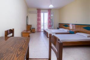 Voodi või voodid majutusasutuse All In Krinas Apart-Hotel toas