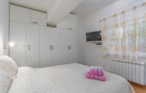 Postel nebo postele na pokoji v ubytování Apartmani Cupar