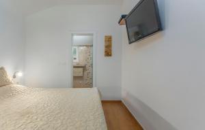 Postel nebo postele na pokoji v ubytování Apartmani Cupar