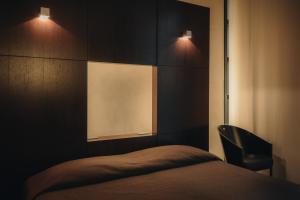 Postel nebo postele na pokoji v ubytování DelleArti Design Hotel
