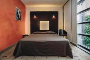 Postel nebo postele na pokoji v ubytování DelleArti Design Hotel