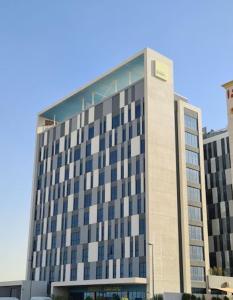 a large building with a lot of windows at Lovely Ensuite Rooms for STUDENTS ONLY , DUBAI - SK in Dubai