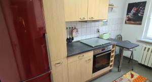 a kitchen with a red refrigerator and a table at Haus im Grünen in Hoppegarten +9 photos