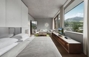 Rúm í herbergi á Schwarzer Adler Kitzbühel - Adults Only