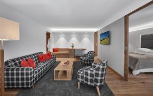Rúm í herbergi á Schwarzer Adler Kitzbühel - Adults Only