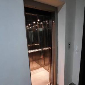 a glass door to a shower in a room at seaside apartment in Durrës