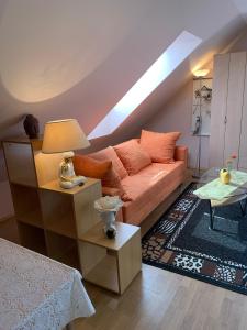 a living room with a couch and a table at Villa Sonnenschein in Hévíz