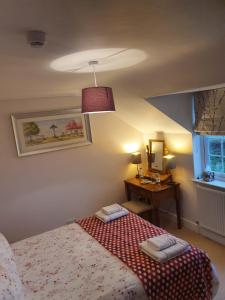 Ένα ή περισσότερα κρεβάτια σε δωμάτιο στο The Croft Guest House +9 φωτογραφίες