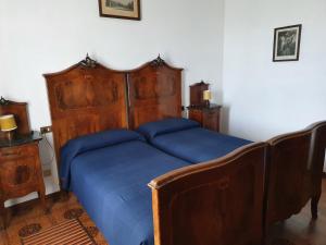 Postel nebo postele na pokoji v ubytování Hotel Madonna di Luciago