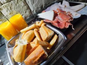 a tray of food with a sandwich and french fries at Hotel Plata in Ibi