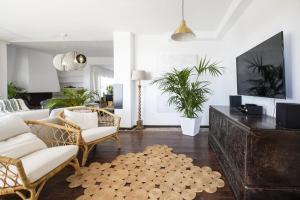 a living room with a couch and chairs and a table at Villa Luxury Punta de Teno - Canary Good Vibes in Buenavista del Norte