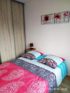 two beds sitting next to each other in a bedroom at Gite du patureau in Belleray