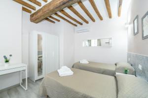 מיטה או מיטות בחדר ב-Residenza Borgo Guazzo