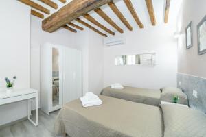Postel nebo postele na pokoji v ubytování Residenza Borgo Guazzo