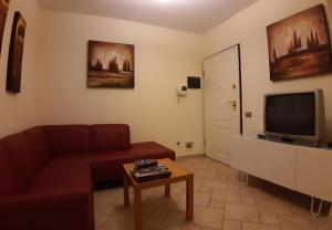 TV a/nebo společenská místnost v ubytování Studio Sole e Residenza Luna Assisi
