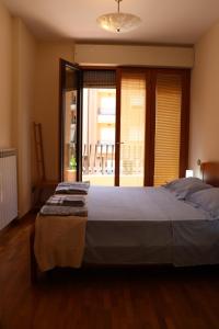 Un ou plusieurs lits dans un hébergement de l'établissement Studio Sole e Residenza Luna Assisi