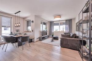 a living room with a couch and a table at Apartment BergRoof in Garmisch-Partenkirchen
