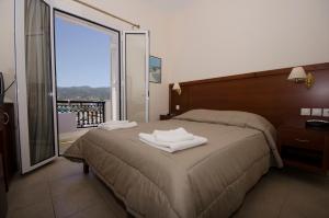 Postel nebo postele na pokoji v ubytování Hotel El Greco