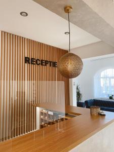 a living room with a dining room table with at Hotel Meridian in Costinesti