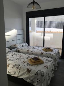 Postel nebo postele na pokoji v ubytování Casa El Dilana - Camporrosso Village - Finestrat + 13 fotografií
