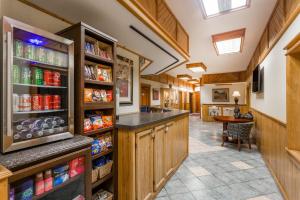 a large kitchen with wooden cabinets and a food pantry at The Inn At Plantation in Weston