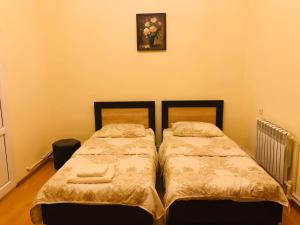 Voodi või voodid majutusasutuse Arm Hotel toas