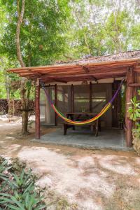 een huis met een hangmat ervoor bij MELI-MELO P&B in Tulum