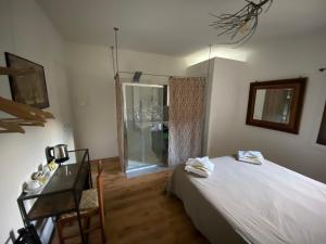 Postel nebo postele na pokoji v ubytování Albergo Wellness Da Febo