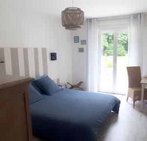 Postel nebo postele na pokoji v ubytování Ailes et Iles