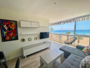 a living room with a view of the beach at Gemelos 1 Modern Seaviews in Benidorm
