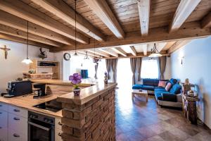 a kitchen and living room with a couch and a table at Obermayrgut in Gallspach