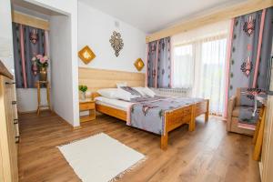 Postel nebo postele na pokoji v ubytování Willa Halinka
