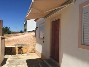 a view from the outside of a house with a patio at Casas da Baronia in Vila Nova da Baronia +7 photos