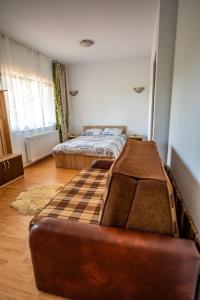 Postel nebo postele na pokoji v ubytování Pensiunea VisAventura