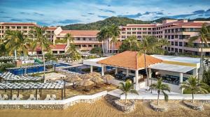 an aerial view of a resort with a swimming pool at Barceló Huatulco in Santa Cruz Huatulco