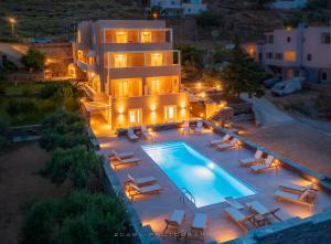 an aerial view of a house with a swimming pool at Ελαιών apartments/Eleon apartments in Korissia