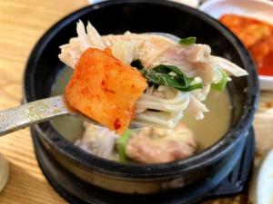 a bowl of soup with a piece of food on a spoon at Oyado Fubuki - Vacation STAY 45516v in Nozawa Onsen +48 photos