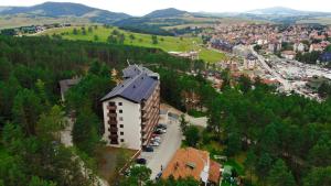 an aerial view of a building in a city at Apartman Green Lux - Balkan Hil 1 in Zlatibor