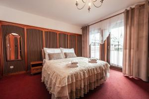 Postel nebo postele na pokoji v ubytování Hotel Litovel