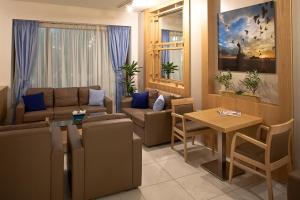 a living room with a couch and a table at Hotel Hermes in Rhodes Town
