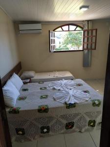 Uma cama ou camas num quarto em Hotel Sol Bahia